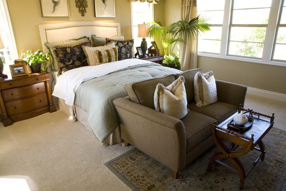 A simple setup have the bedroom favor the wife because she carries the big responsibility of bearing children. Bedroom with sofa at end of bed - Applying Feng Shui to Couples with Opposite Kua Groups