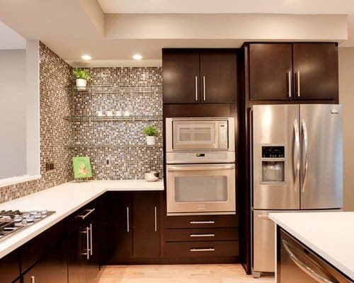 In this image, the refrigerator is next to electric ovens. While some would say that there’s a clash between Water and Fire elements, I’m asking you not to over-classify them. Just stick with the sink and the stove. fridge next to oven appliances min - 33 Kitchen Feng Shui Rules and Tips – Location, Stove, and Basics