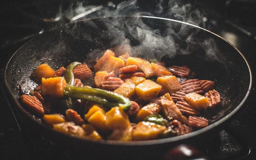 This photo captured some of the harmful vapor produced from stir-frying. These harmful gas can easily spread to all corners of your home if your kitchen is located at the center of the house. frying pan oil vapor captured bad feng shui kitchen - 33 Kitchen Feng Shui Rules and Tips – Location, Stove, and Basics