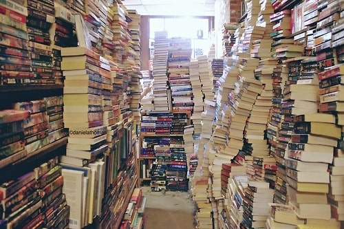 Clutter piled as high as walls have the ability to affect the flow of Qi. Hoarding books as high as walls min - How Clutter Affects You and (Maybe) Your Home’s Feng Shui