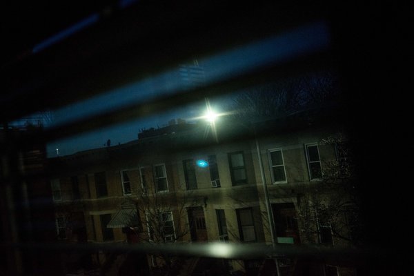 The view from a bedroom in Christopher Stoddard’s home in Windsor Terrace, with a glaring streetlight that shines into the room and makes it hard to sleep. Credit: Andrew Renneisen from The New York Times. Light Pollution New York disrupting sleep - Why Sleeping with Head Under Window is Bad Feng Shui