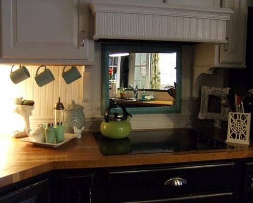 Mirror behind a stove is not the best Feng Shui setup. mirror behind stove not ideal feng shui min - 33 Kitchen Feng Shui Rules and Tips – Location, Stove, and Basics