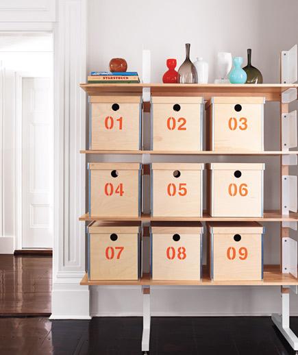 You can use something other than numbers to label your boxes. Photo by David Prince. numbered bins shelf david prince - 19 Easy Decluttering Tips to Improve Feng Shui and Your Life
