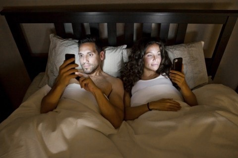 In today’s world, work is not the only factor that’s affecting people’s intimacy in bed. Smartphone in bed affects love min - 27 Feng Shui Tips to Attract Love and Improve Romance