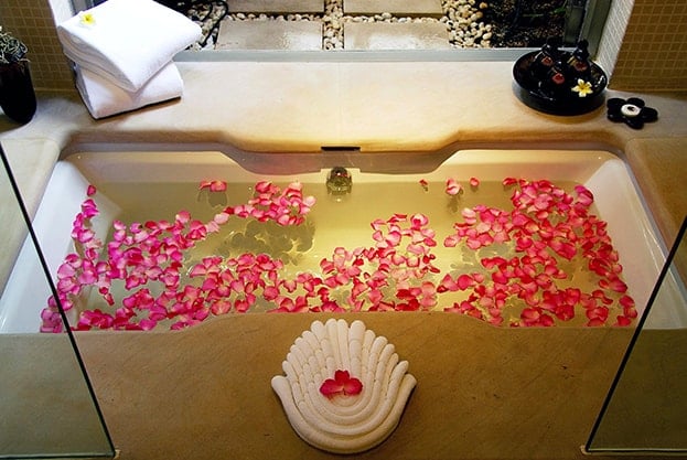 Putting fresh flowers inside a water-filled acrylic bathtub is commonly seen as a symbol of romance. Adding flowers can always create a more sensual energy in your bathroom. Spa bath soaking tub for feng shui love min - 27 Feng Shui Tips to Attract Love and Improve Romance