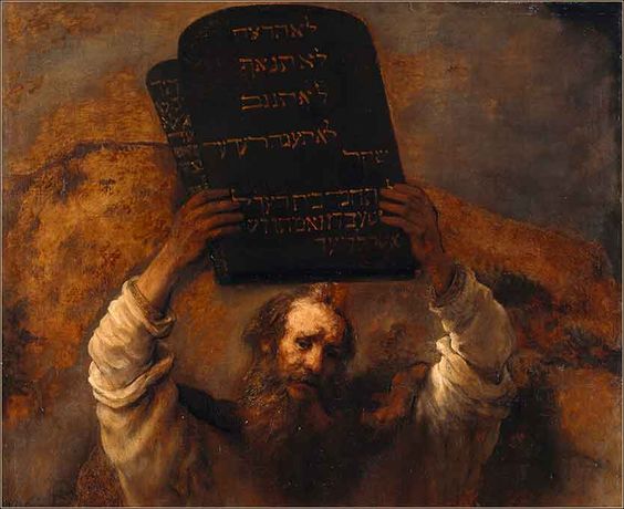 The ten commandments in stone tablets on the hands of Moses. These are the moral codes where believers should follow. Ten Commandments Stone Tablets Moses - Why Feng Shui is NOT a Religion or Superstition